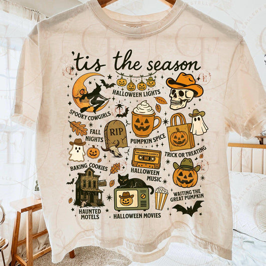 Beige t-shirt with Halloween-themed graphics and text on a hanger.