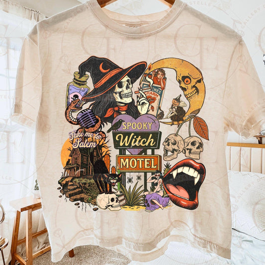 Beige t-shirt with Halloween-themed design featuring a witch, skulls, and a motel sign.