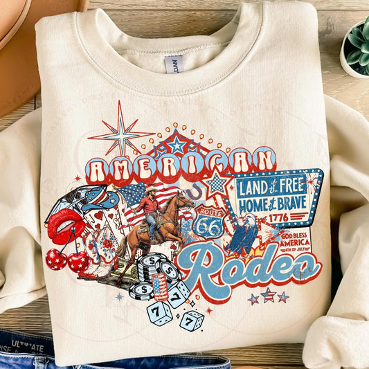 White sweatshirt with 'American Rodeo' graphic design featuring a cowboy, American flag, and Route 66 elements.