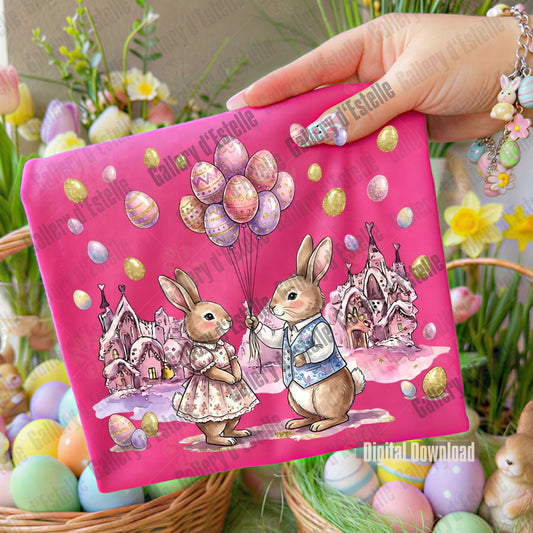 Pink Easter-themed folded T-Shirt with cartoon bunnies and balloons, held by a hand against a floral background.