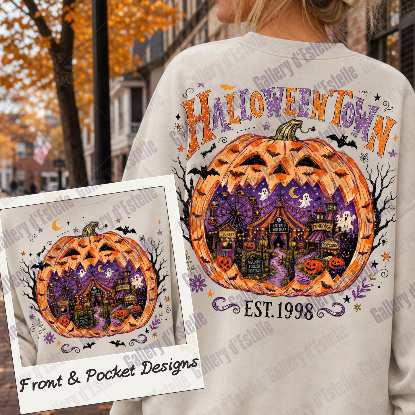 A person wearing a cream sweatshirt outdoors, shown from the back. The sweatshirt features a large Halloween-themed graphic with a carved orange pumpkin, purple haunted house, bats, and the words 'HALLOWEENTOWN'