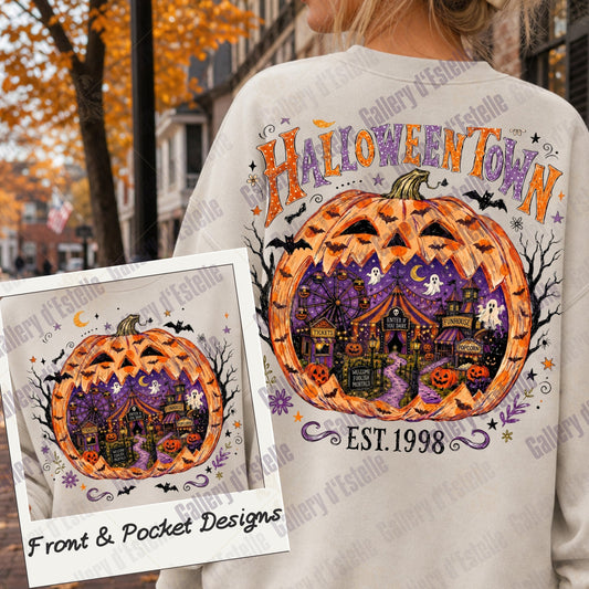 A person wearing a cream sweatshirt outdoors, shown from the back. The sweatshirt features a large Halloween-themed graphic with a carved orange pumpkin, purple haunted house, bats, and the words 'HALLOWEENTOWN'