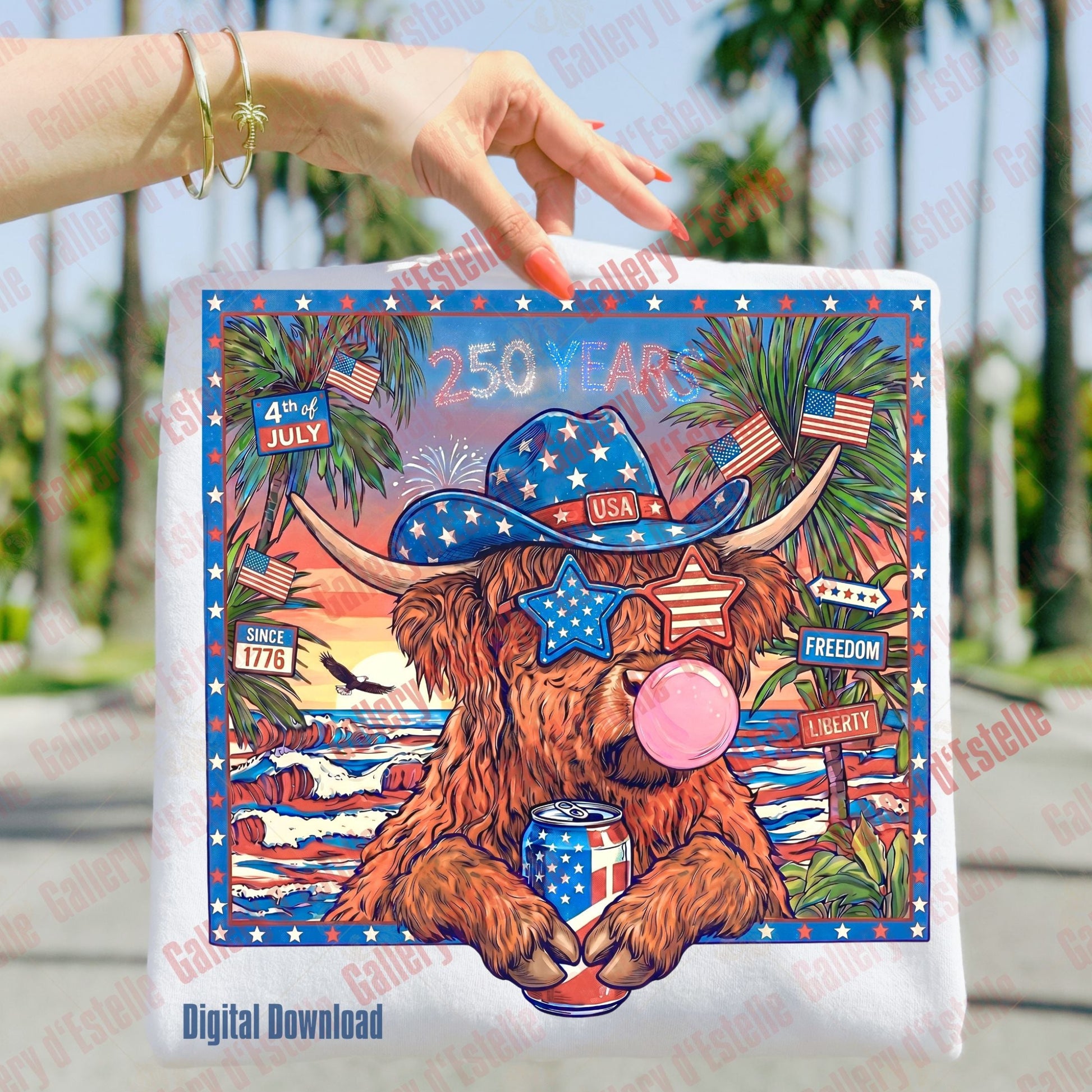 Folded T-shirt with a patriotic highland cow wearing a cowboy hat and American flag sunglasses, set against a scenic background.
