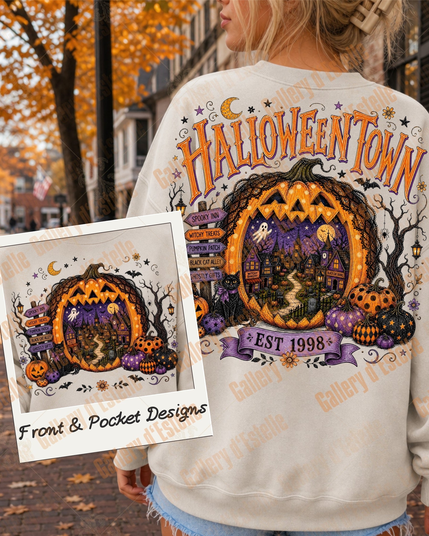 A woman outdoors wearing a white sweatshirt with a large Halloween-themed graphic on the back reading 'HALLOWEENTOWN' and showing a jack-o'-lantern porch scene. A smaller inset shows the matching pocket design.