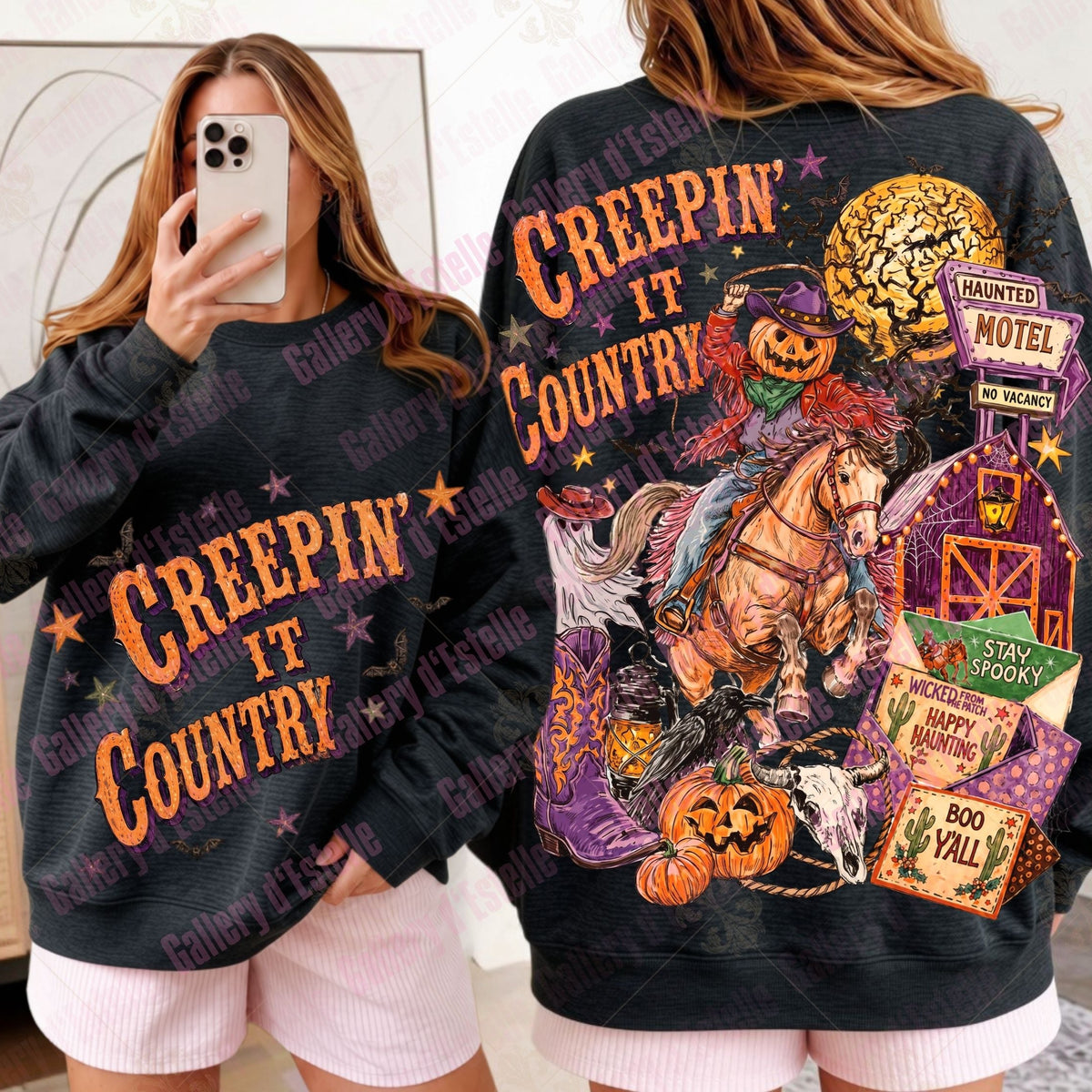 A woman modeling a black graphic sweatshirt with two views: a mirror selfie showing the front with orange 'CREEPIN' IT COUNTRY' text, and a back view showing a large Halloween-themed country western graphic with a horse, barn, pumpkins, and signs.