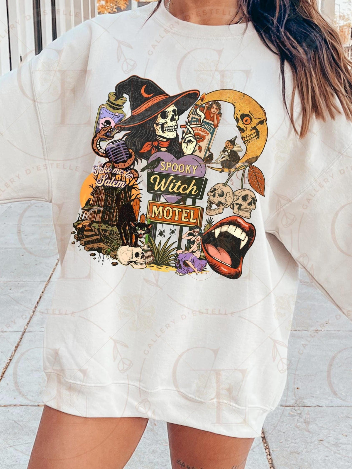 White sweatshirt with Halloween-themed graphic design worn by a person.
