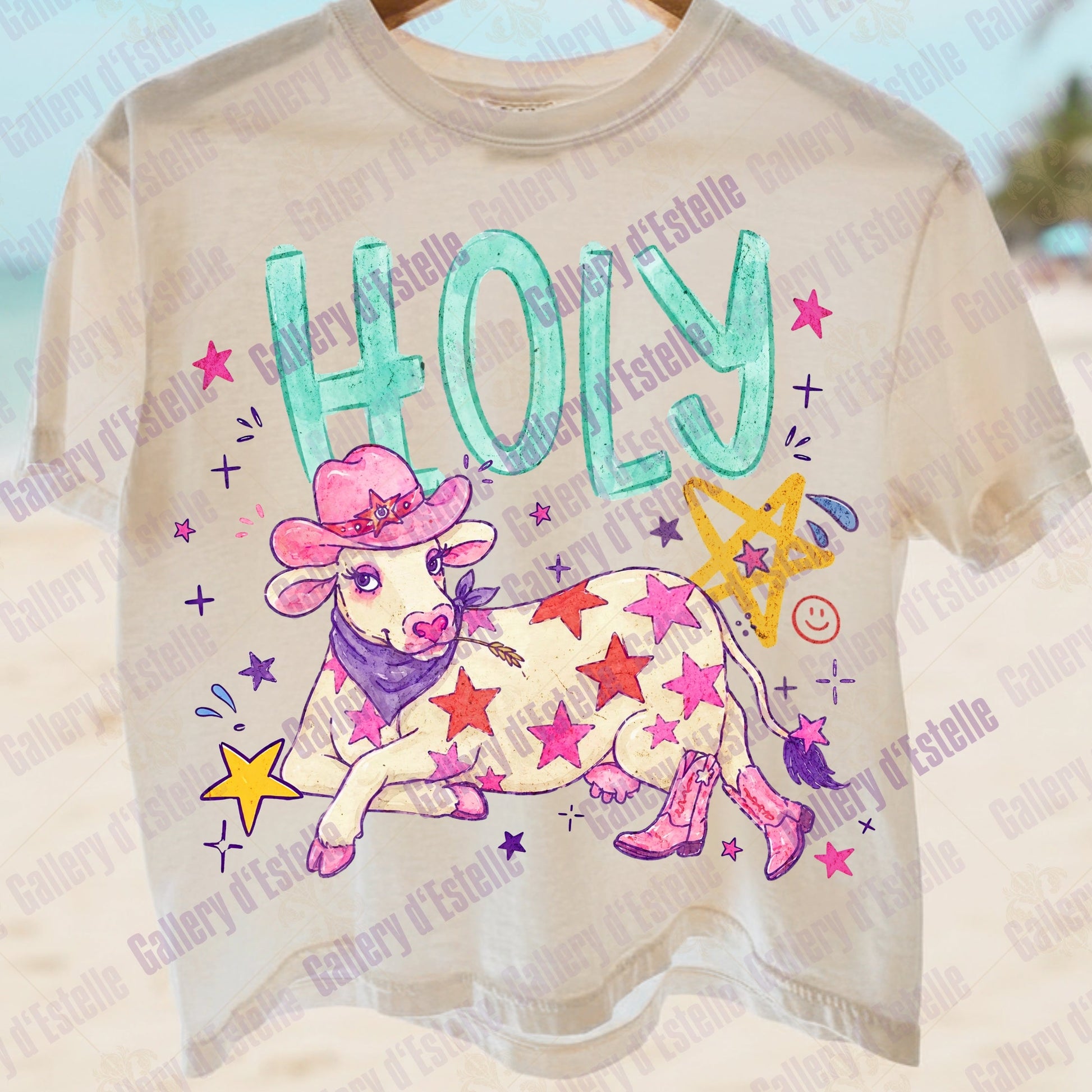 Funny t-shirt with a cowgirl-themed design featuring a cow in a pink hat and boots, surrounded by stars and the word 'HOLLY'.