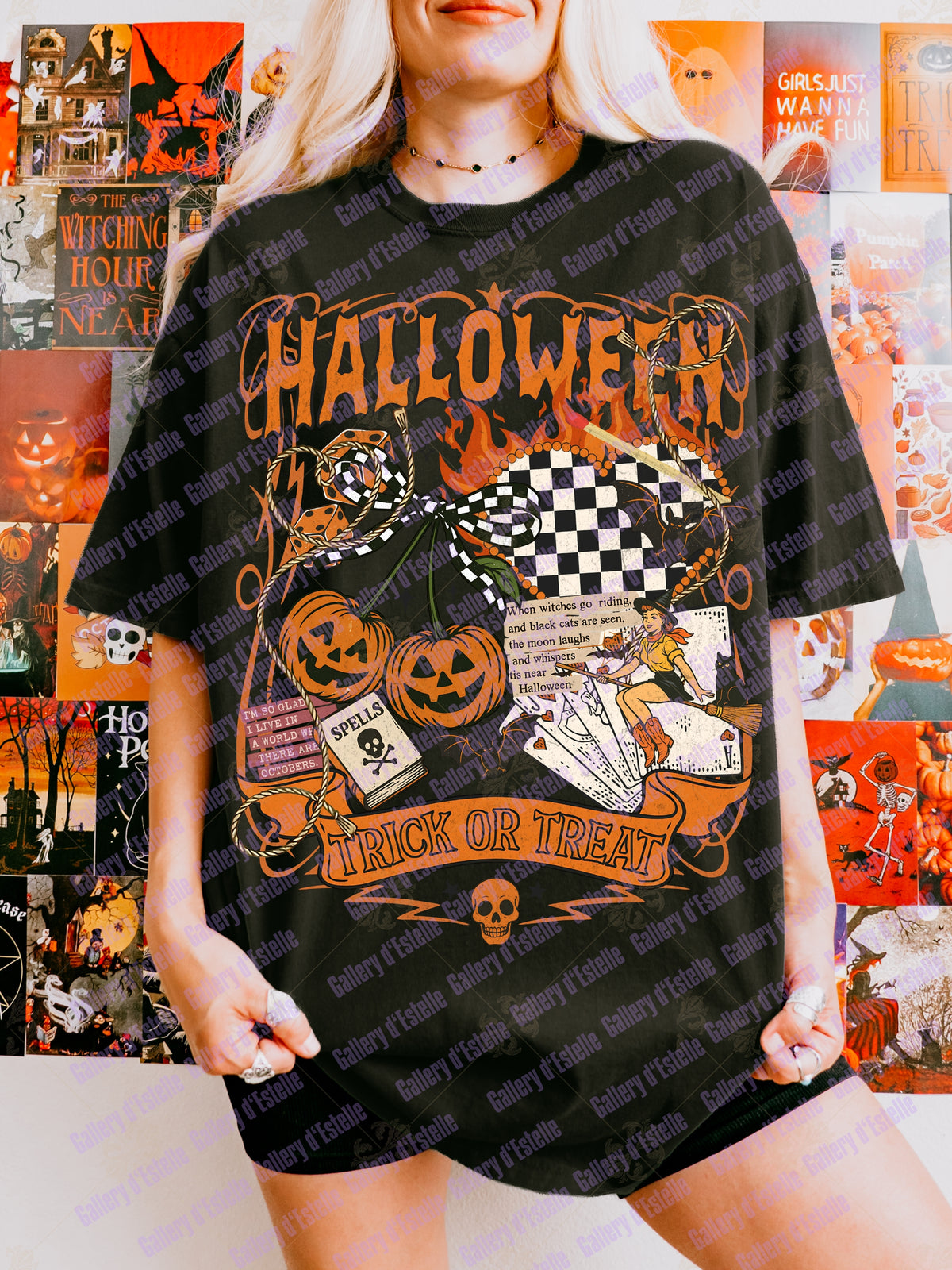 A woman wearing an oversized black graphic T-shirt with a Halloween design featuring pumpkins, flames, a witch, and the words 'HALLOWEEN' and 'TRICK OR TREAT'. The background is a collage of Halloween-themed posters.