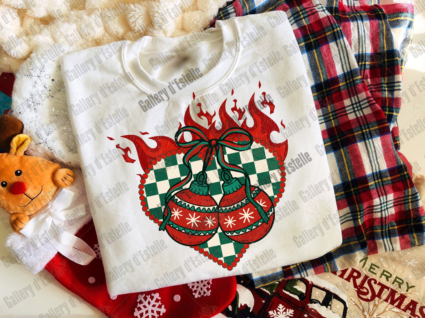 White sweatshirt with Christmas design on a plaid fabric background