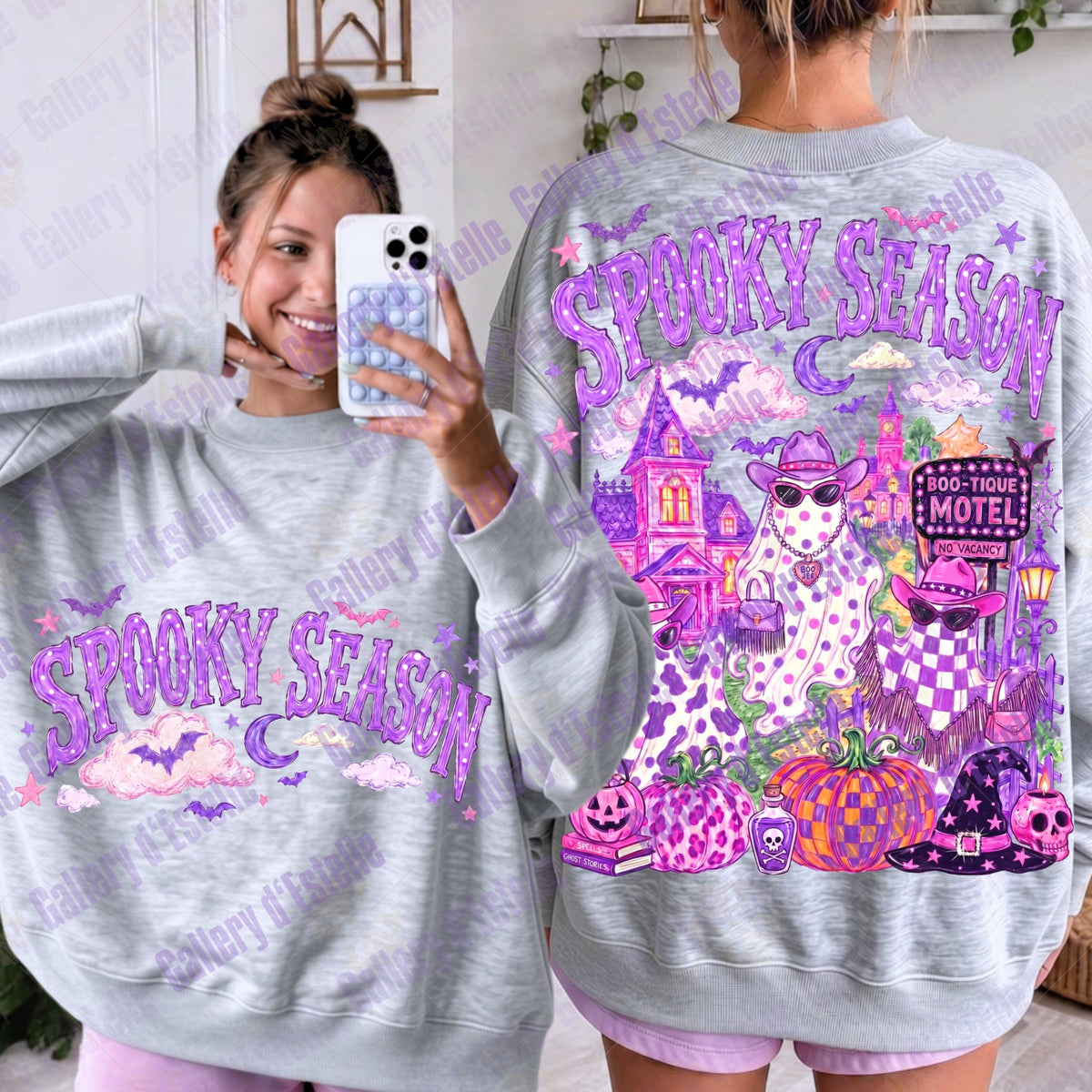 A light heather gray crewneck sweatshirt shown on a model from both front and back, featuring a colorful 'Spooky Season' Halloween graphic with purple text, a haunted house, glam ghosts, pumpkins, and bats.