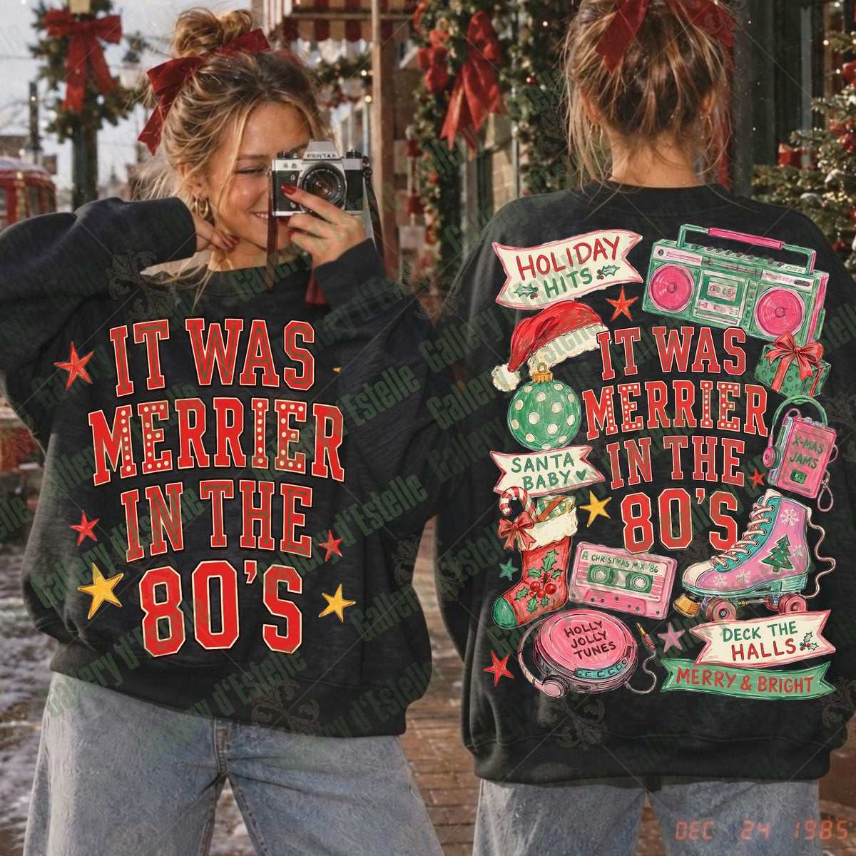 Two women modeling matching black sweatshirts with retro 1980s holiday graphics. The front view shows red text reading 'IT WAS MERRIER IN THE 80'S' with red and yellow stars, and the back view shows a colorful collage of boomboxes, a Santa hat, a pink roller skate, and holiday phrases on a black background.
