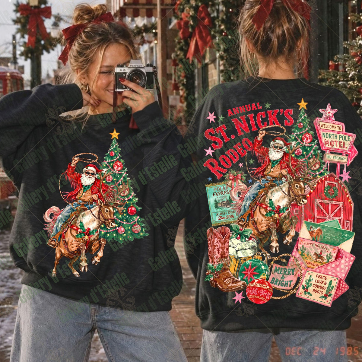 A woman shown from the front and back wearing a black crewneck sweatshirt with a large, colorful Christmas-themed graphic print featuring a Santa-clad cowboy riding a horse next to a decorated Christmas tree and festive signs.