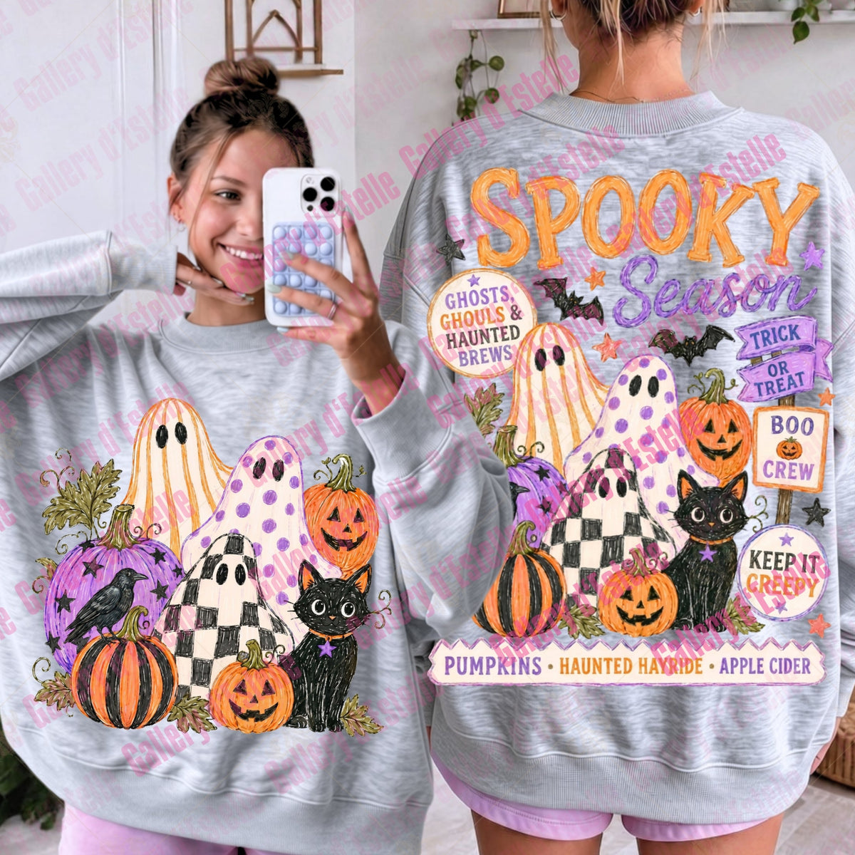 A woman modeling a light gray heather crewneck sweatshirt, showing both the front and back views. The sweatshirt features a colorful 'Spooky Season' graphic with pumpkins, ghosts, a black cat, and a raven.