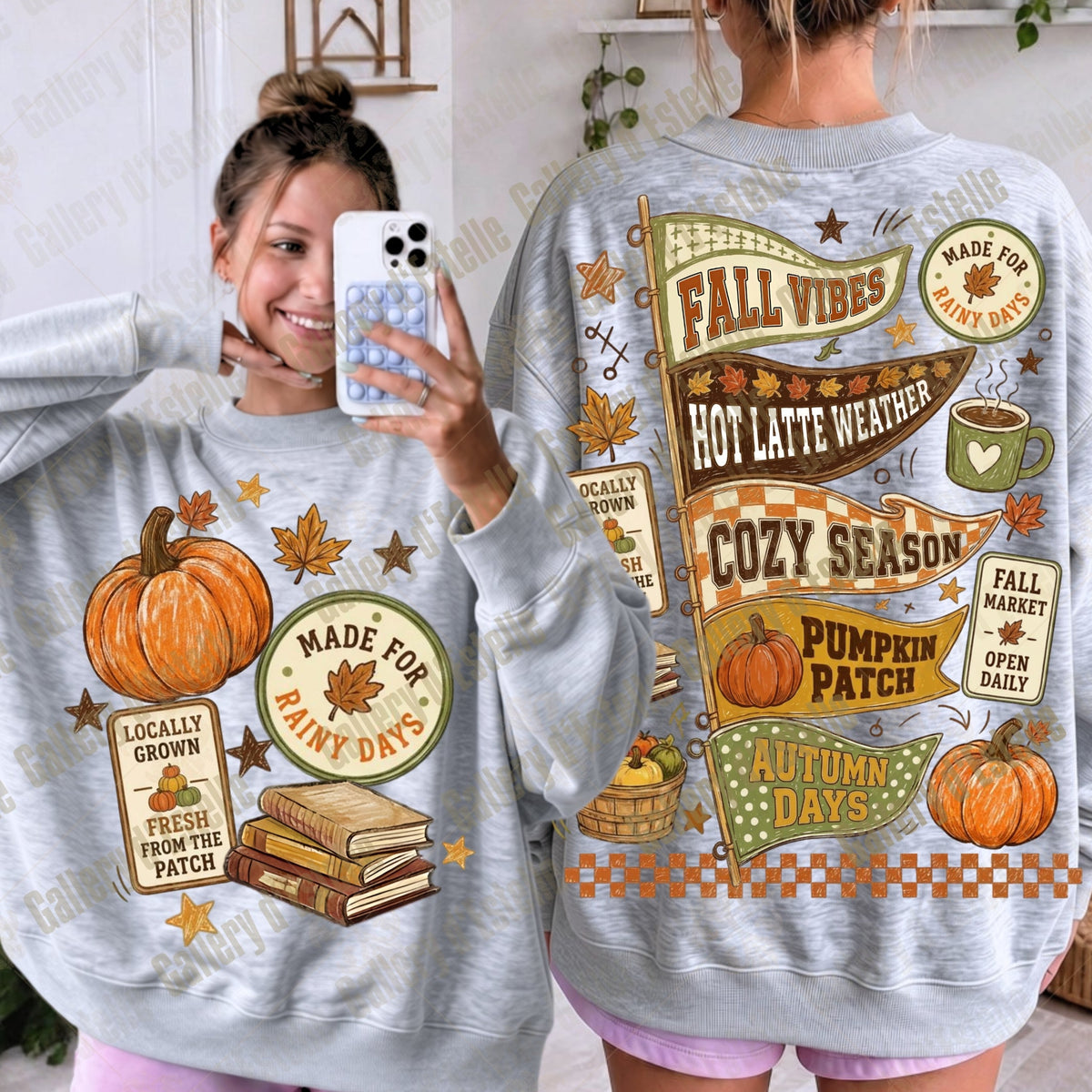 A light gray crewneck sweatshirt shown on a model from both front and back, featuring a colorful autumn-themed graphic print with pumpkins, fall leaves, and seasonal text.