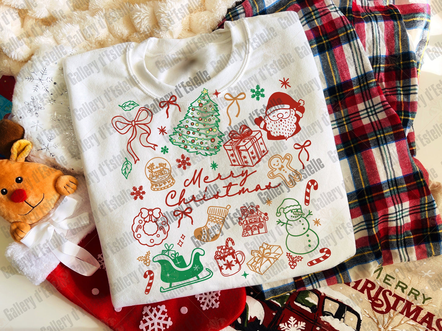 Christmas-themed t-shirt with festive designs on a plaid fabric background