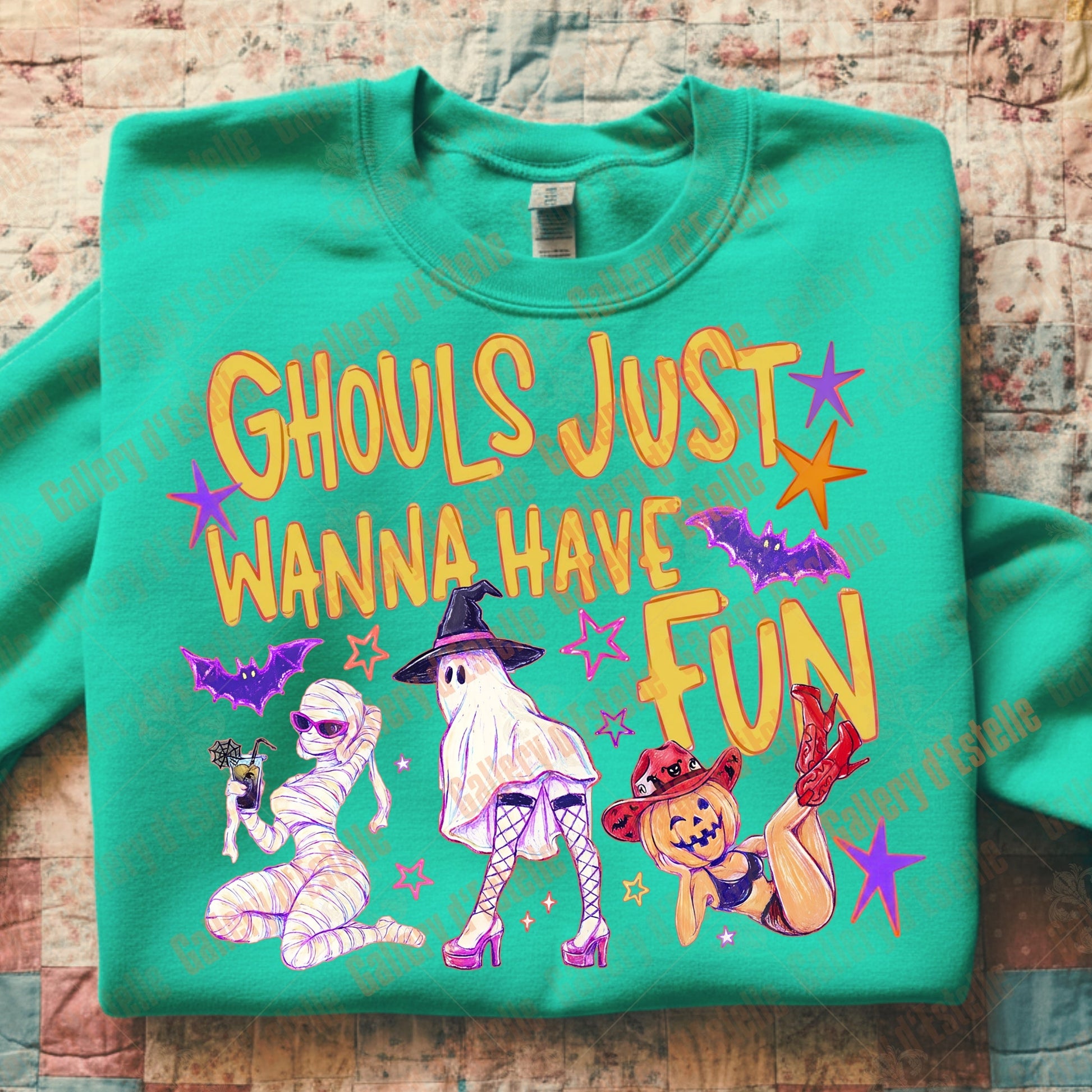 Green sweatshirt with Halloween-themed design and text on a wooden surface