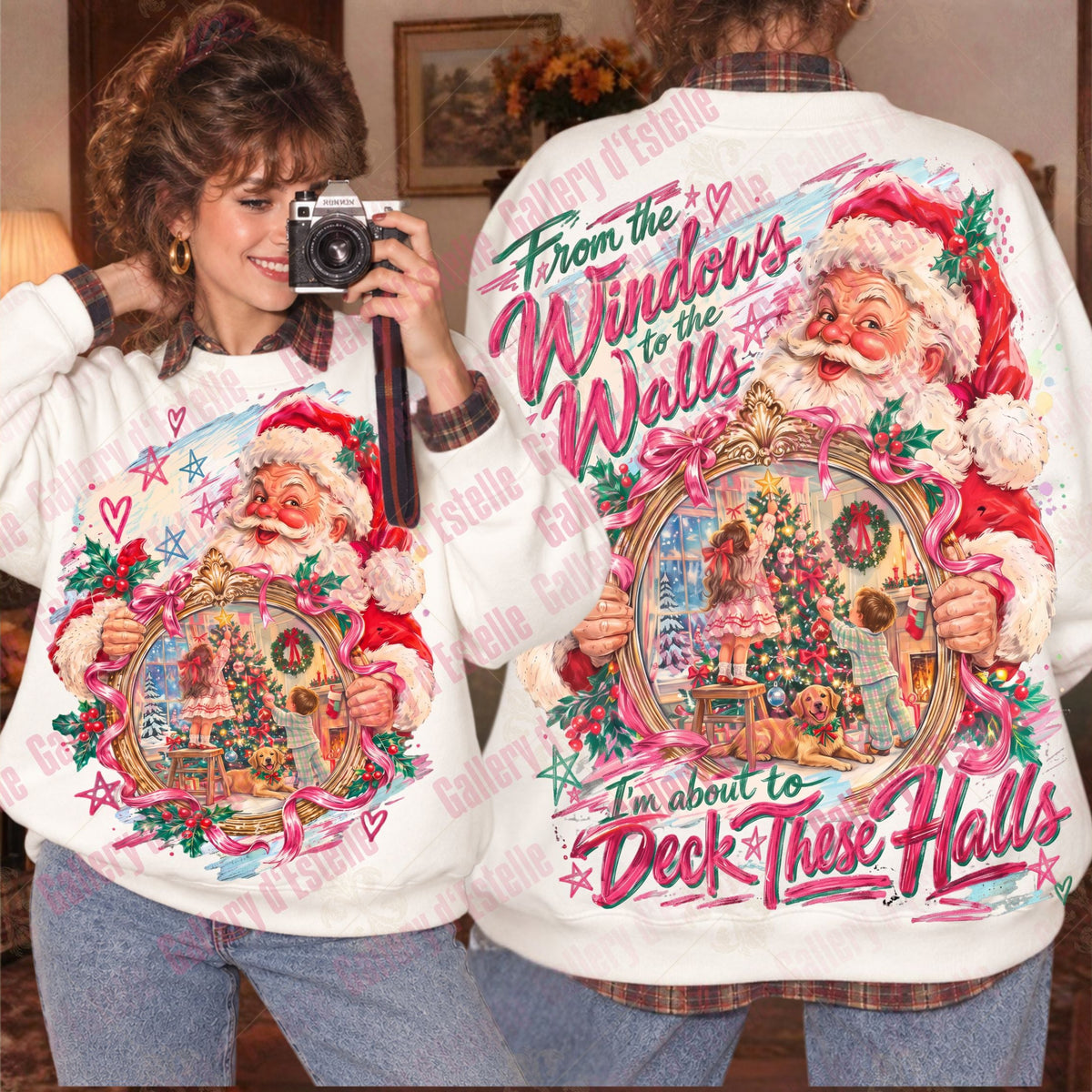 A person wearing a white Christmas-themed sweatshirt is shown in a mirror selfie, displaying both the front and back graphics. The sweatshirt features a large colorful illustration of Santa Claus holding a decorated Christmas tree, with the text 'From the Windows to the Walls' and 'I'm about to Deck These Halls' in pink and red lettering.