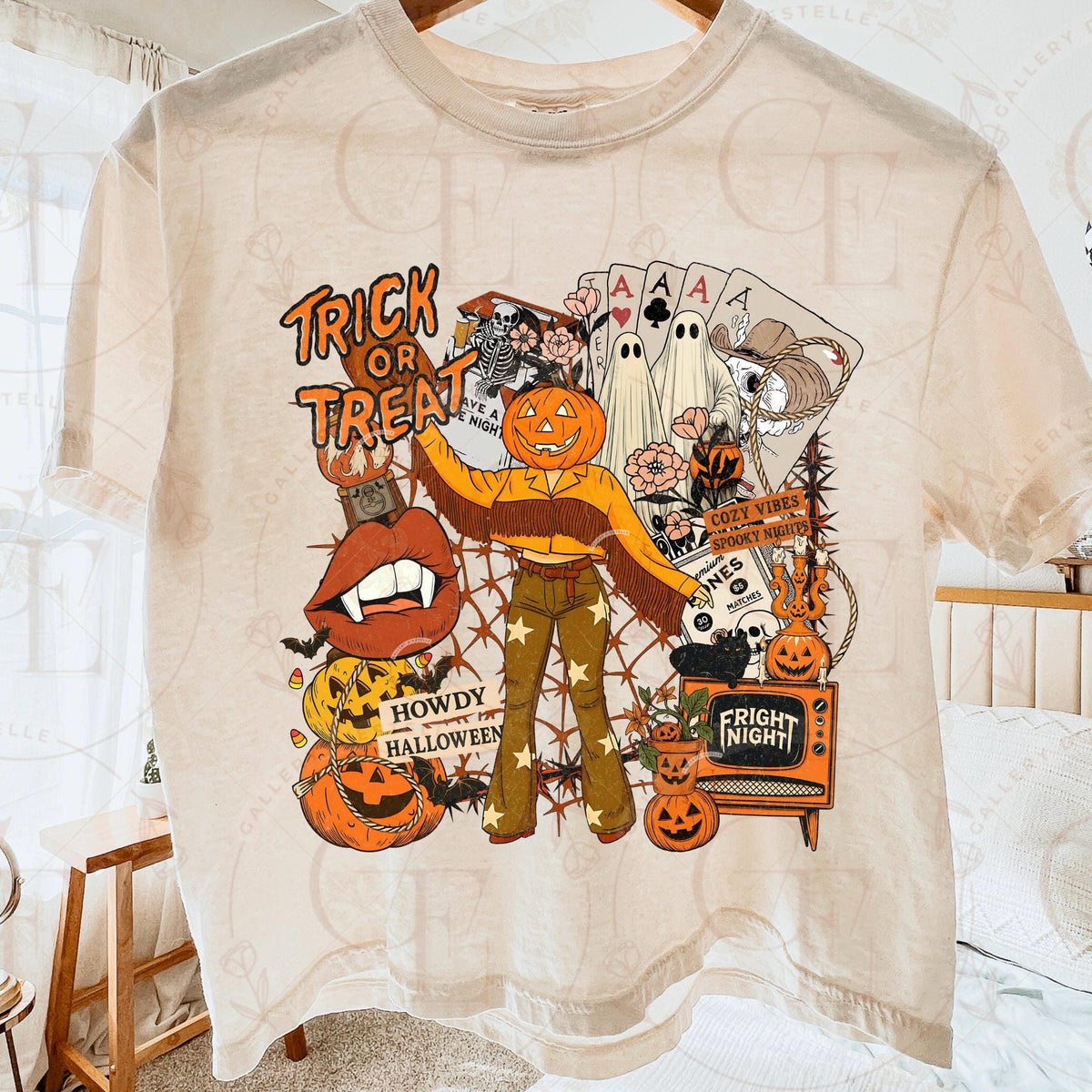 Beige t-shirt with Halloween-themed graphics and text on a white background.