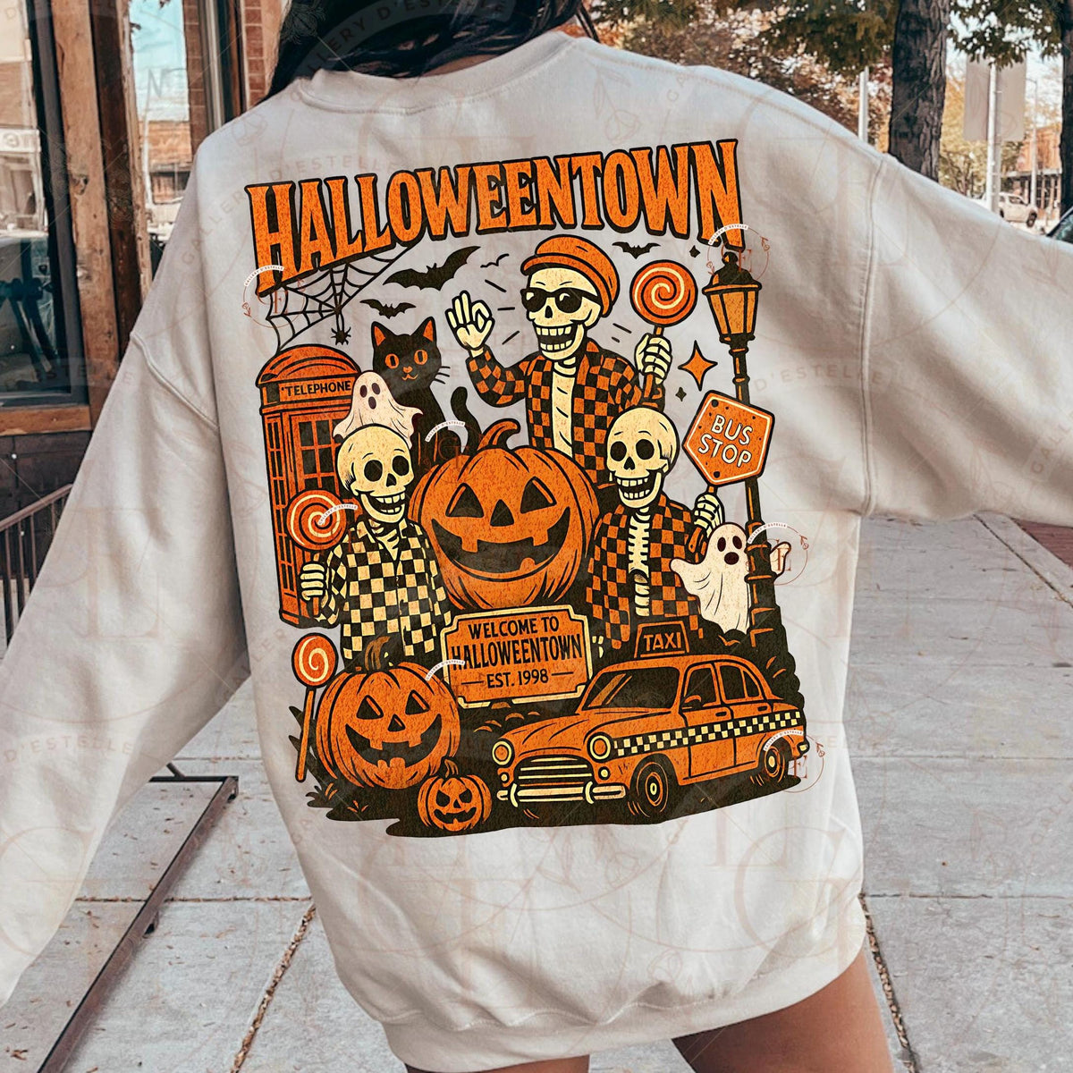 Person wearing a hoodie with 'Halloweentown' graphic design on the back.