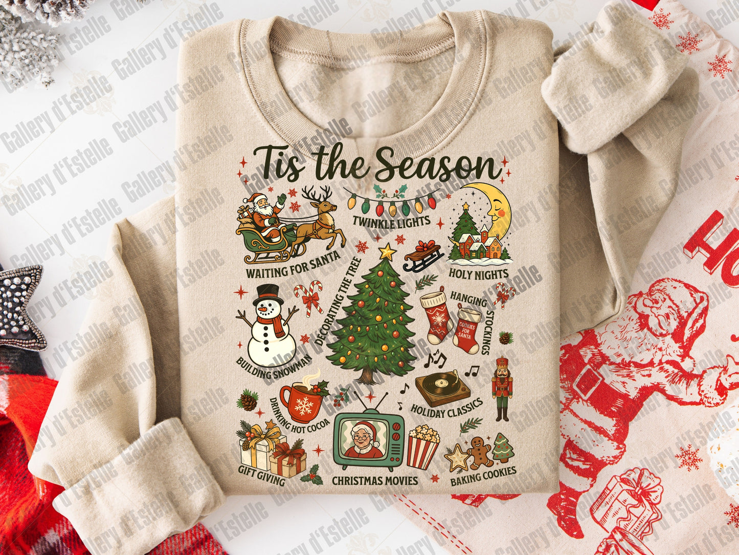 Beige sweatshirt with Christmas-themed graphics and text on a decorative background