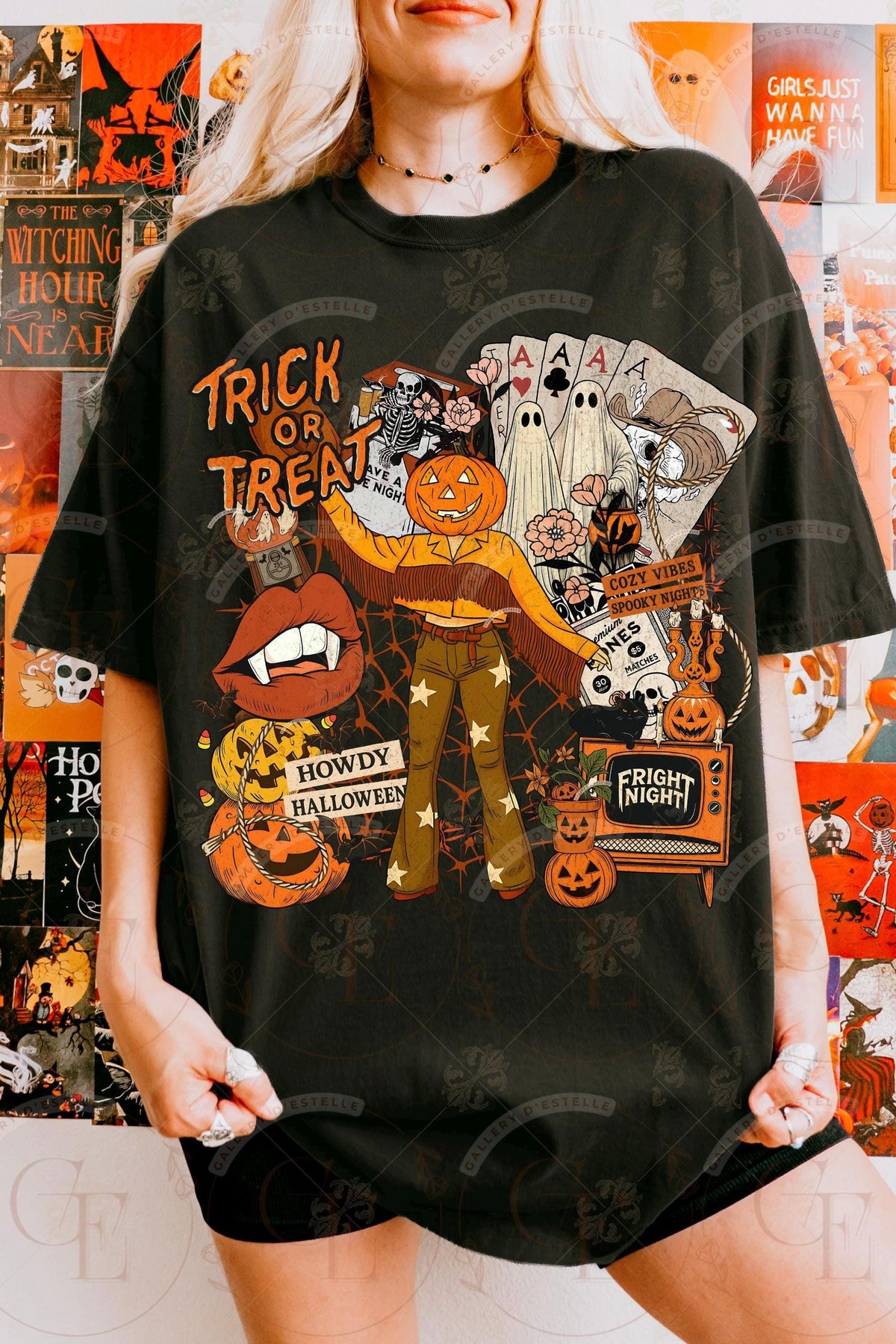 Person wearing a black Halloween-themed t-shirt with graphics and text.