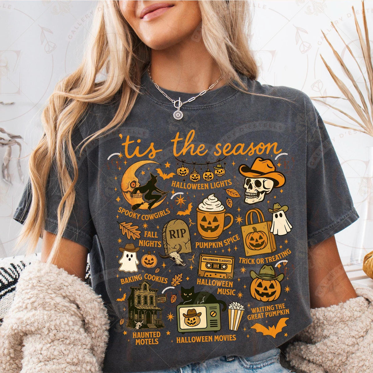 Person wearing a Halloween-themed t-shirt with various graphics and text.