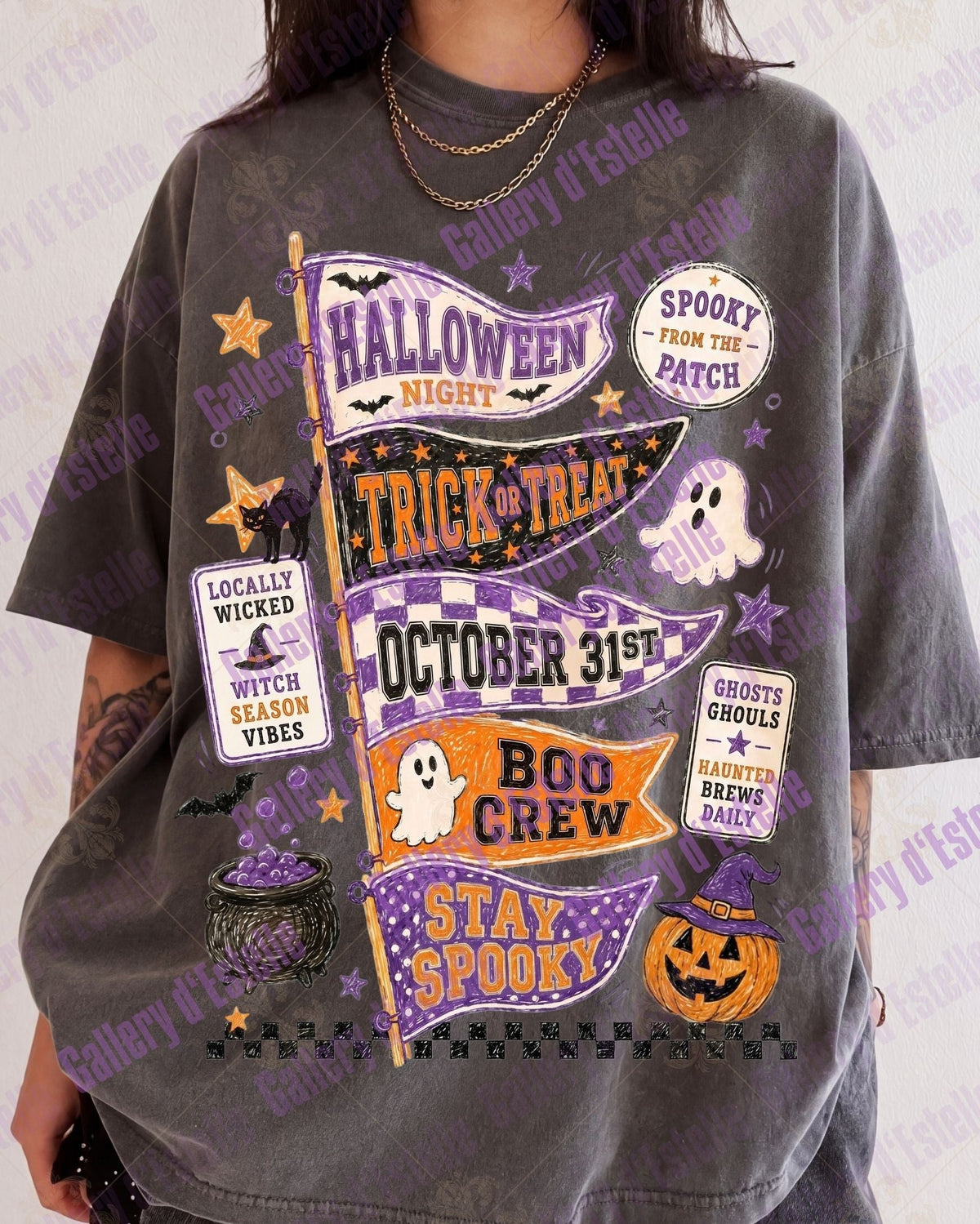 A person wearing an oversized charcoal gray graphic T-shirt with Halloween-themed printed designs including banners, ghosts, pumpkins, and text such as 'Halloween Night' and 'Stay Spooky'.