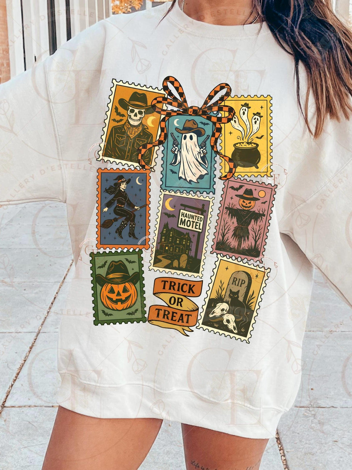 White t-shirt with Halloween-themed graphic design featuring various spooky illustrations.