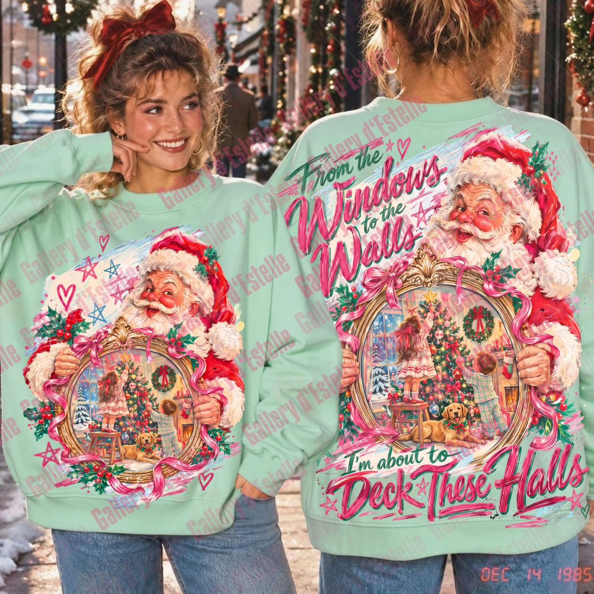 A mint green crewneck sweatshirt with a large, colorful vintage-style Christmas graphic of Santa Claus, shown on two models displaying the front and back designs. The background depicts a festive, snow-covered street scene with holiday lights.