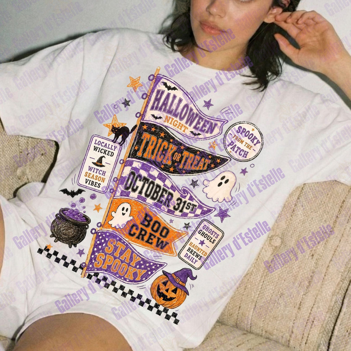 A woman reclining on a beige couch wearing a white graphic T-shirt with Halloween-themed text and illustrations, including 'Halloween Witches', 'Trick or Treat', 'October 31st', 'Bod Crew', 'Stay Sponco', a cauldron, ghosts, and pumpkins. 