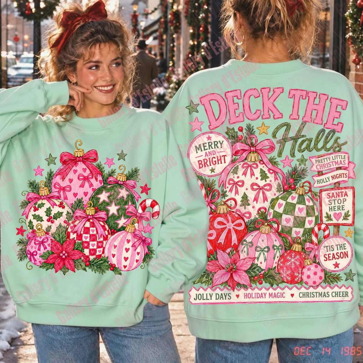 A mint green crewneck sweatshirt with a large pink and red Christmas ornament graphic on the front, shown on a model from both the front and back. The back features a large graphic reading 'DECK THE Halls' with additional holiday text and ornaments.
