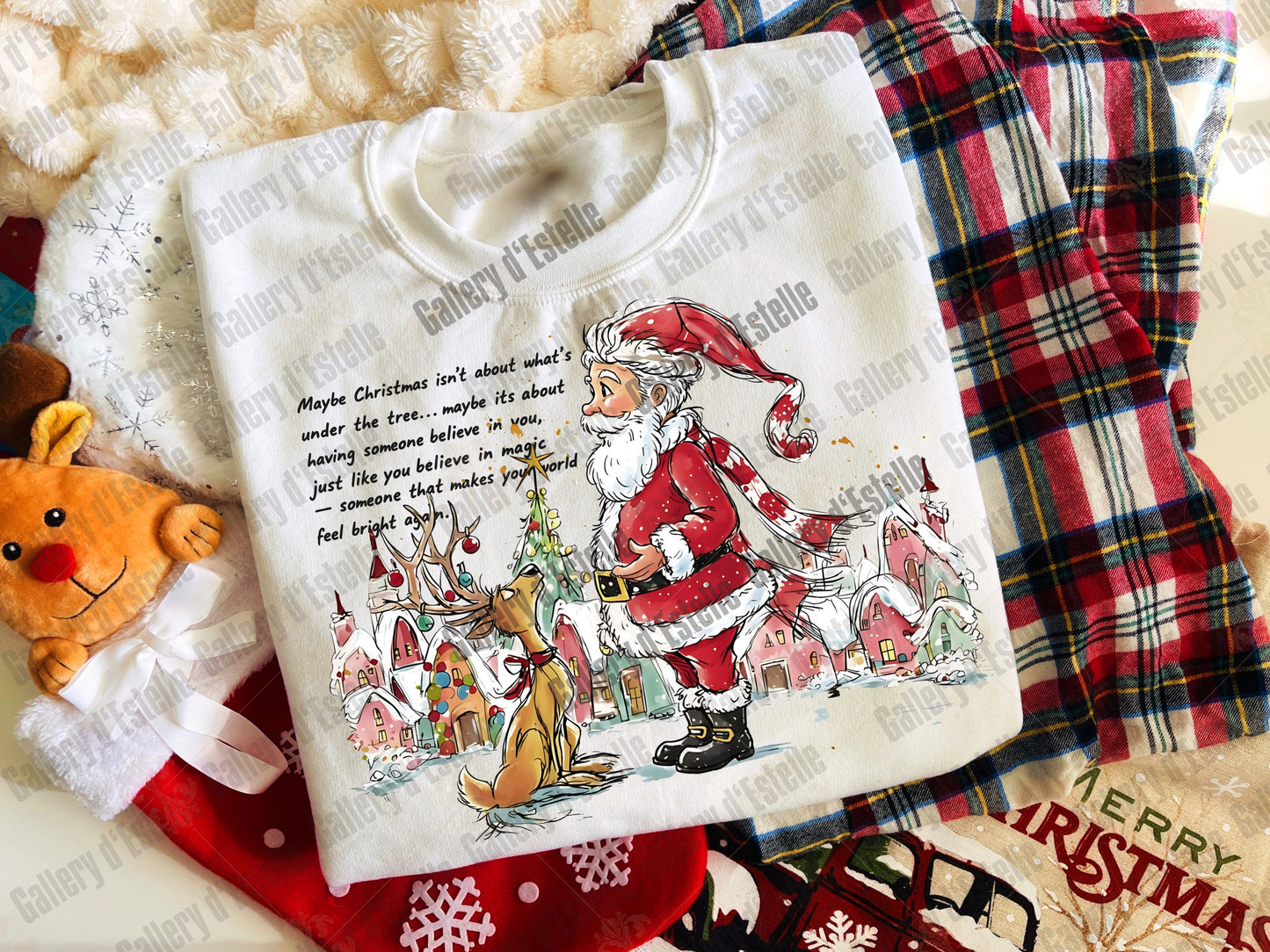 White sweatshirt with Santa Claus design on a plaid fabric background