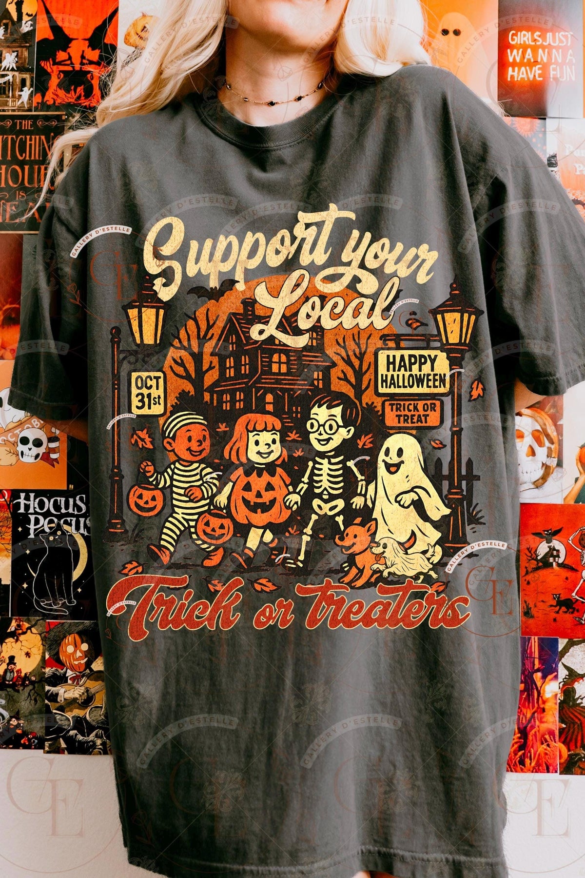Person wearing a Halloween-themed t-shirt with graphics and text.