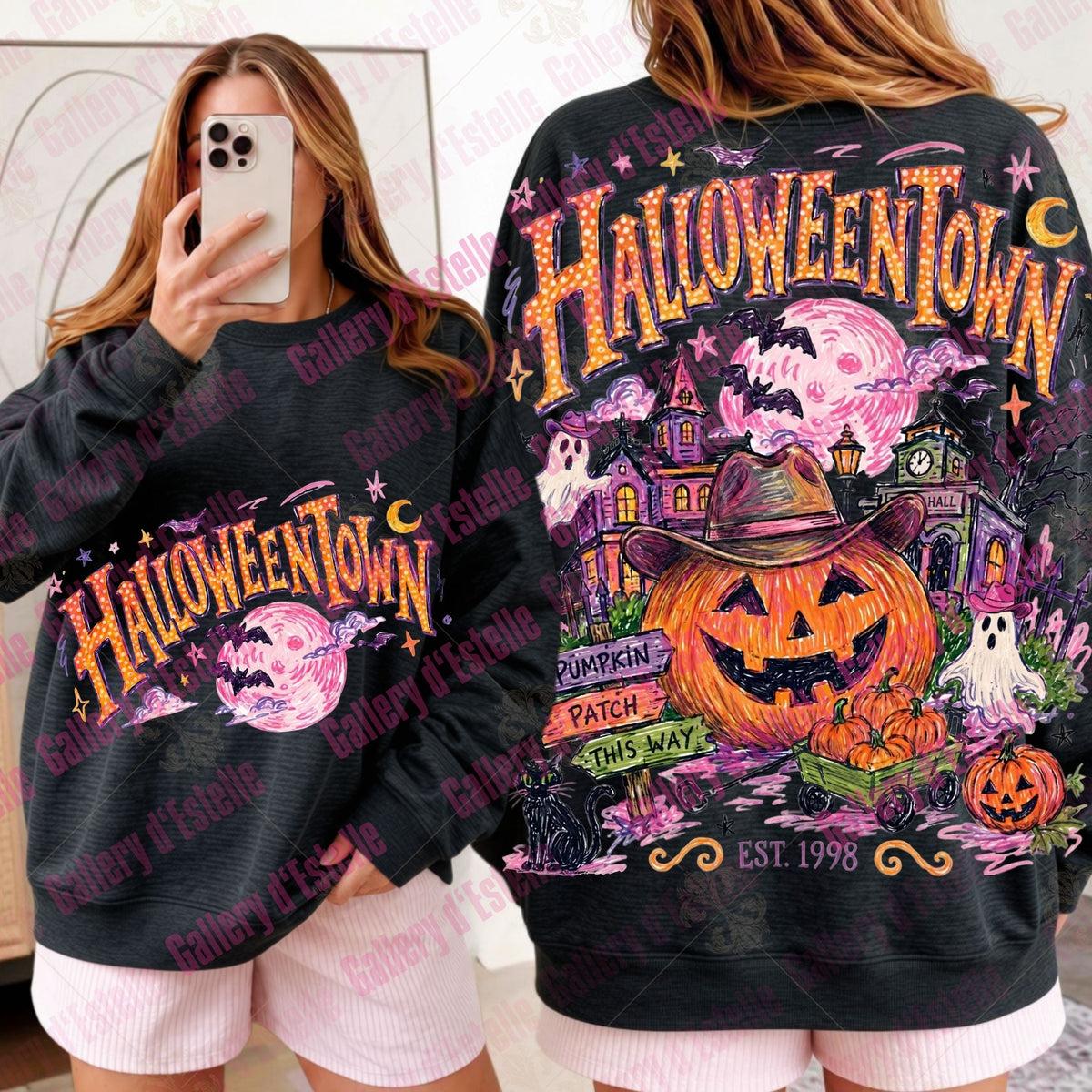 A person modeling a black graphic sweatshirt shown from both front and back. The sweatshirt features colorful Halloween-themed artwork with the words 'HALLOWEENTOWN' in large orange letters, a jack-o'-lantern, haunted house, moon, ghosts, and stars.