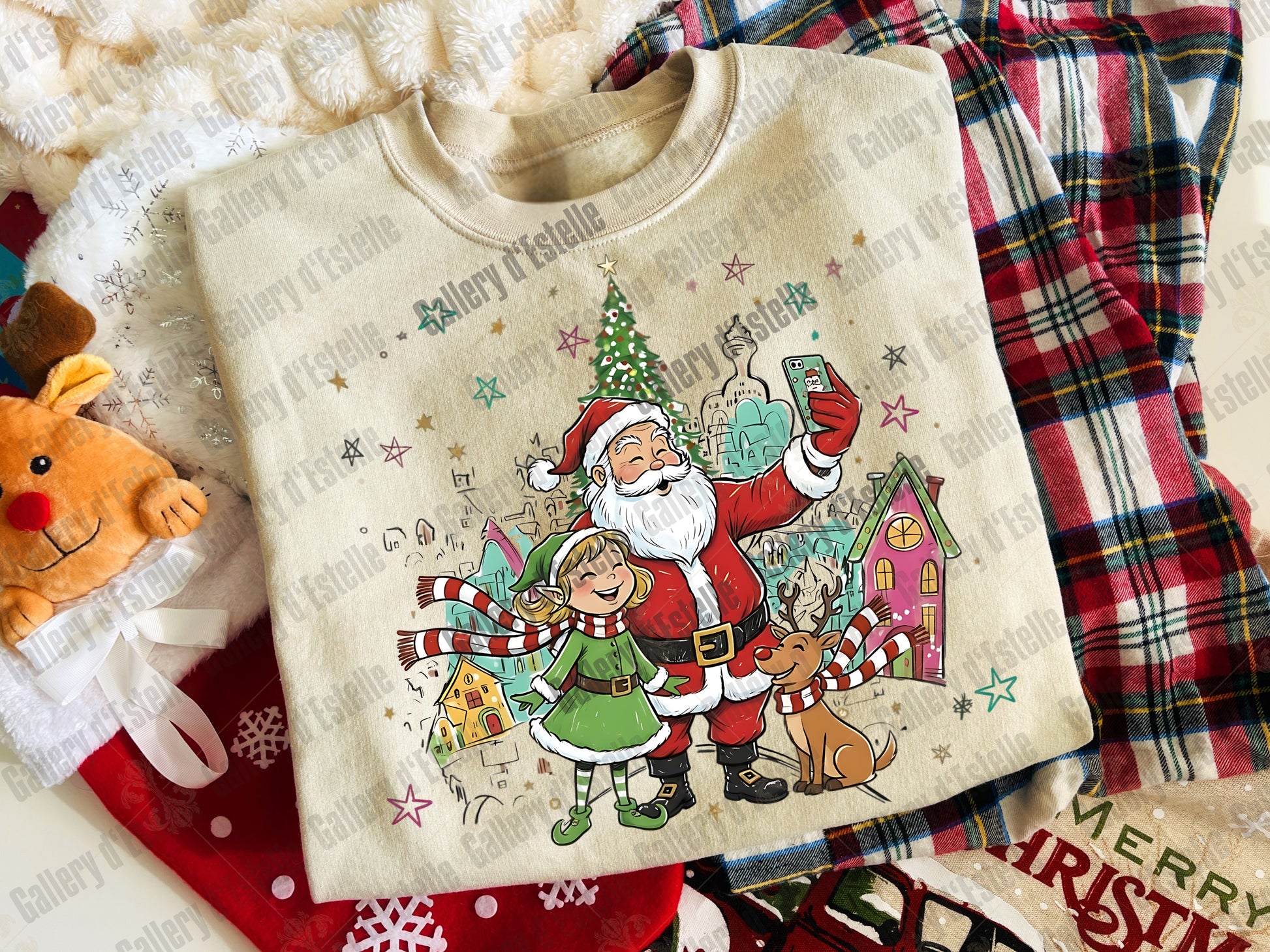 Beige sweatshirt with Christmas-themed design featuring Santa Claus, reindeer, and a house on a patterned background.