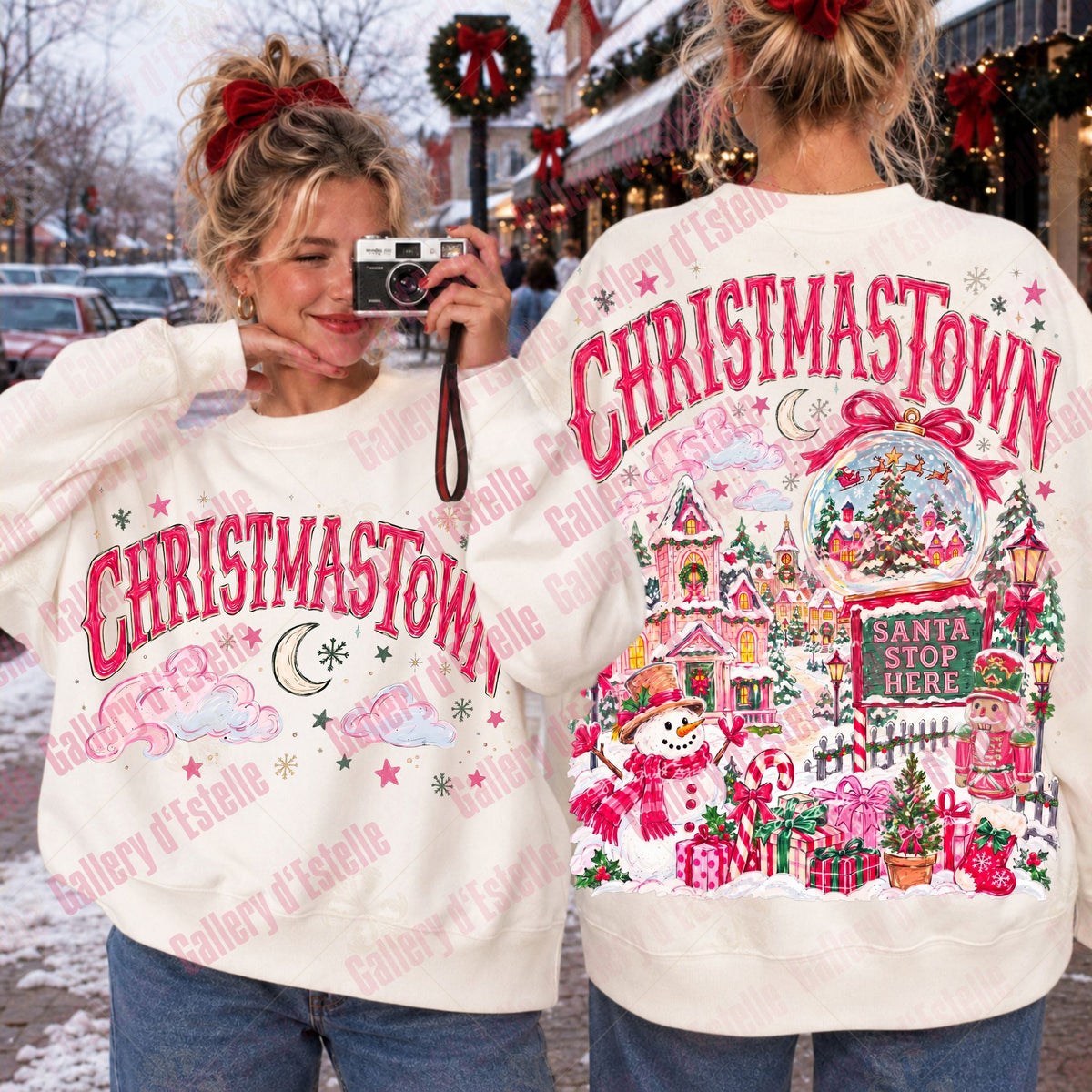 Two women modeling a cream-colored Christmas sweatshirt, showing both the front and back designs. The front features 'CHRISTMASTOWN' in pink arched letters with a crescent moon and stars.