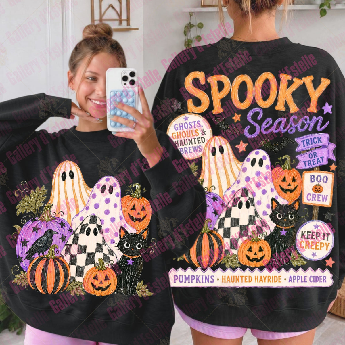 A person modeling a black oversized sweatshirt shown from both front and back. The sweatshirt features colorful Halloween graphics including pumpkins, ghosts, cats, stars, and text reading 'Spooky Season' and 'Ghosts, Ghosts & Haunted House'.