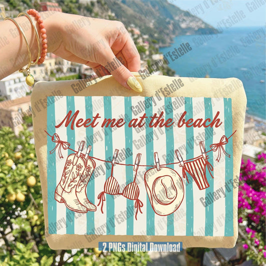 Hand holding a shirt with 'Meet me at the beach' text and western summer items on a scenic background.