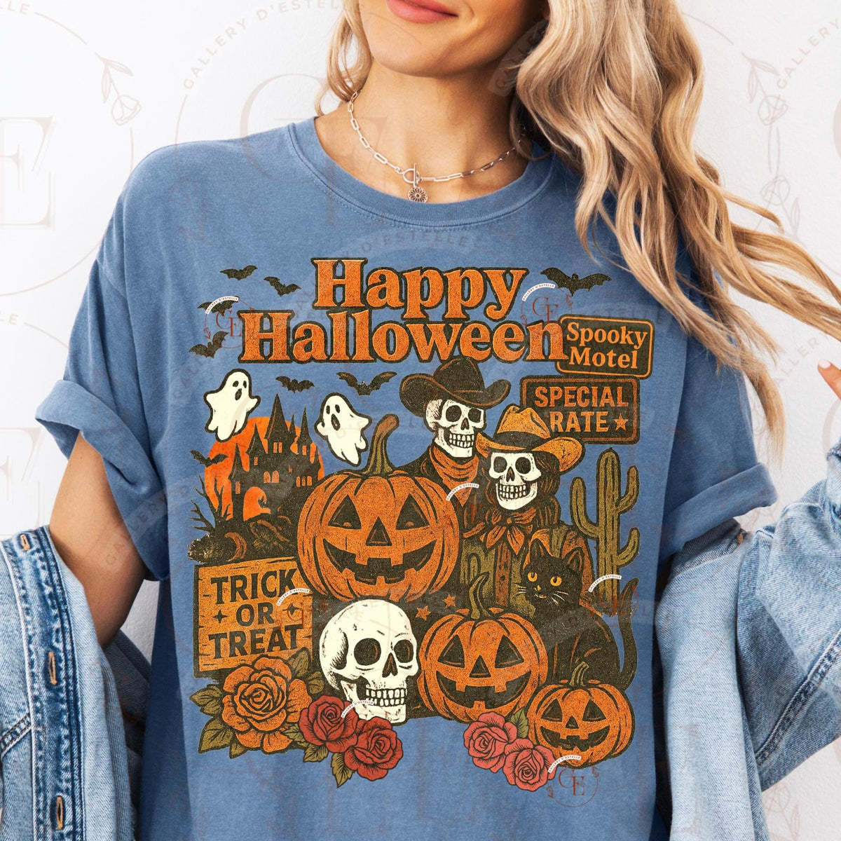 Person wearing a blue t-shirt with Halloween-themed graphics and text.