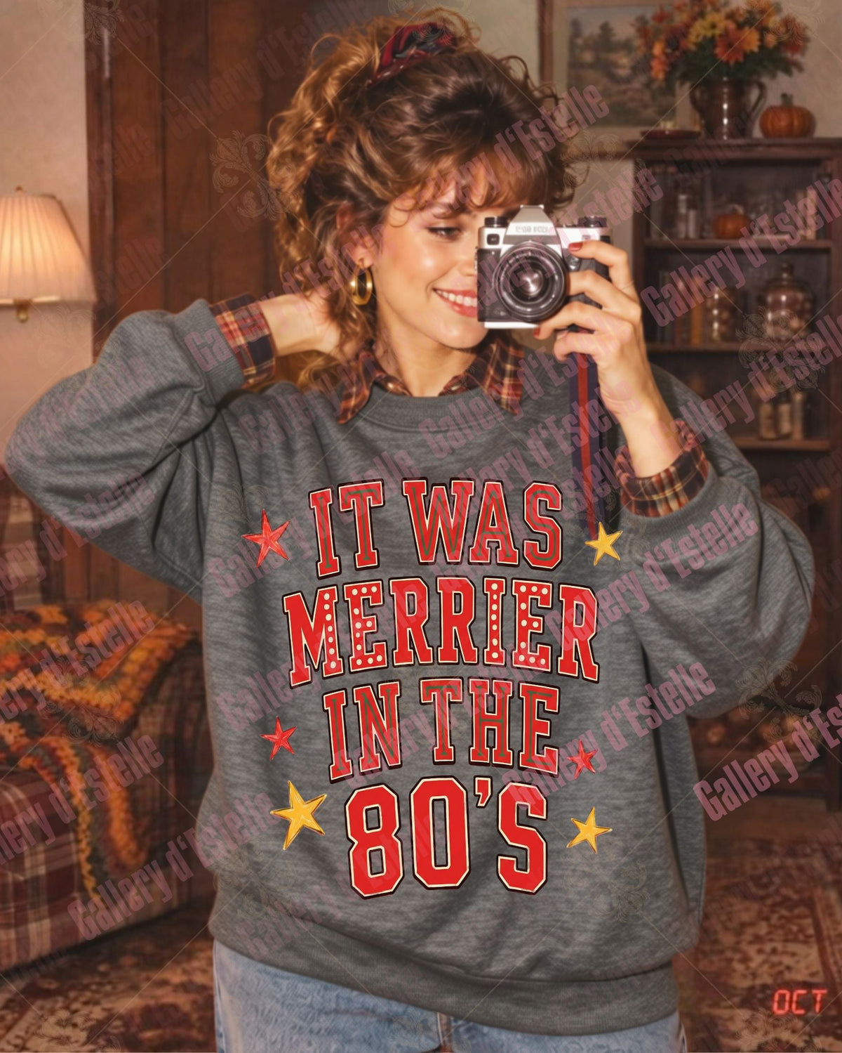 A woman in a retro 1980s-style room takes a mirror selfie wearing a gray crewneck sweatshirt with 'IT WAS MORRIER IN THE 80'S' printed in red and yellow text.