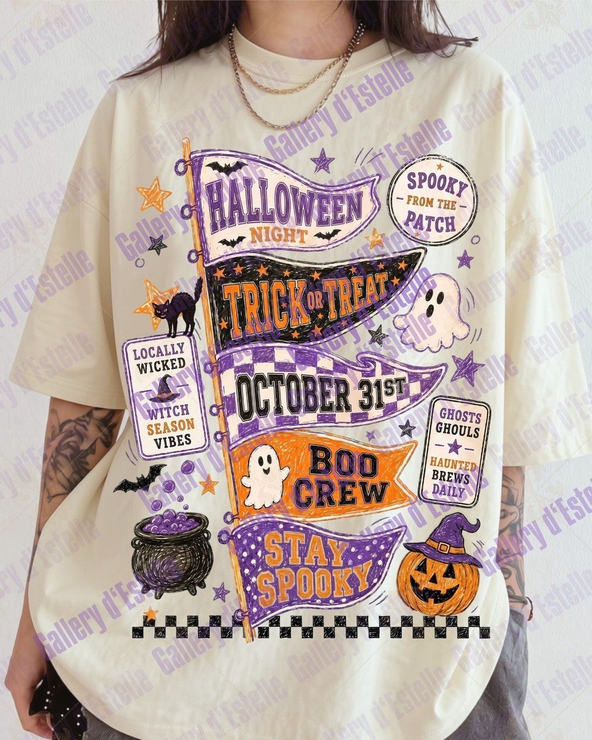 A person wearing an oversized cream-colored t-shirt with a colorful, vintage-style Halloween graphic print featuring purple, orange, and black text and illustrations.