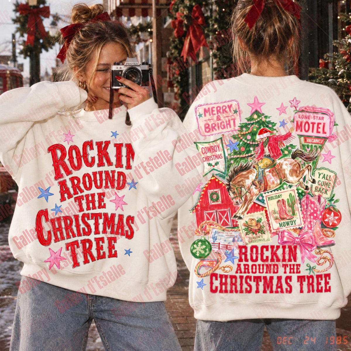 Two women shown from the back and front wearing matching white Christmas-themed sweatshirts with colorful holiday graphics and the text 'Rockin' Around the Christmas Tree.' The left woman is holding a camera, and the right woman shows the back design.