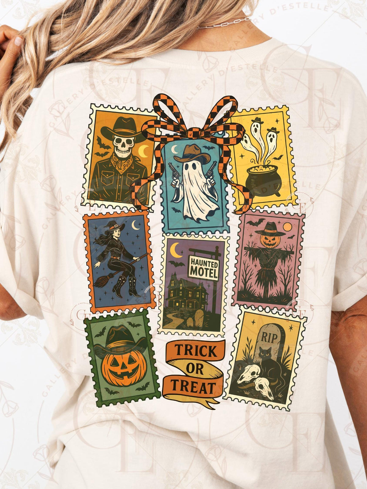 White t-shirt with Halloween-themed postage stamp designs on the back