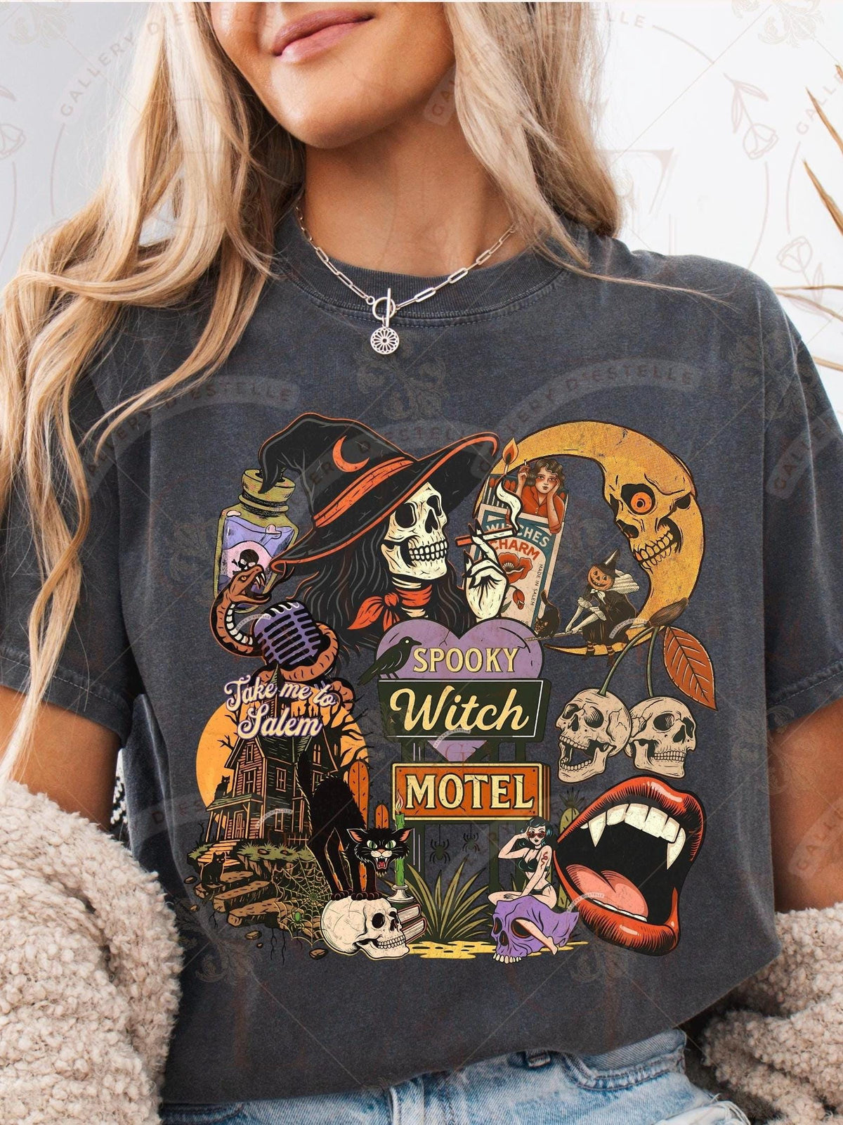 Person wearing a dark gray t-shirt with Halloween-themed graphics and text.