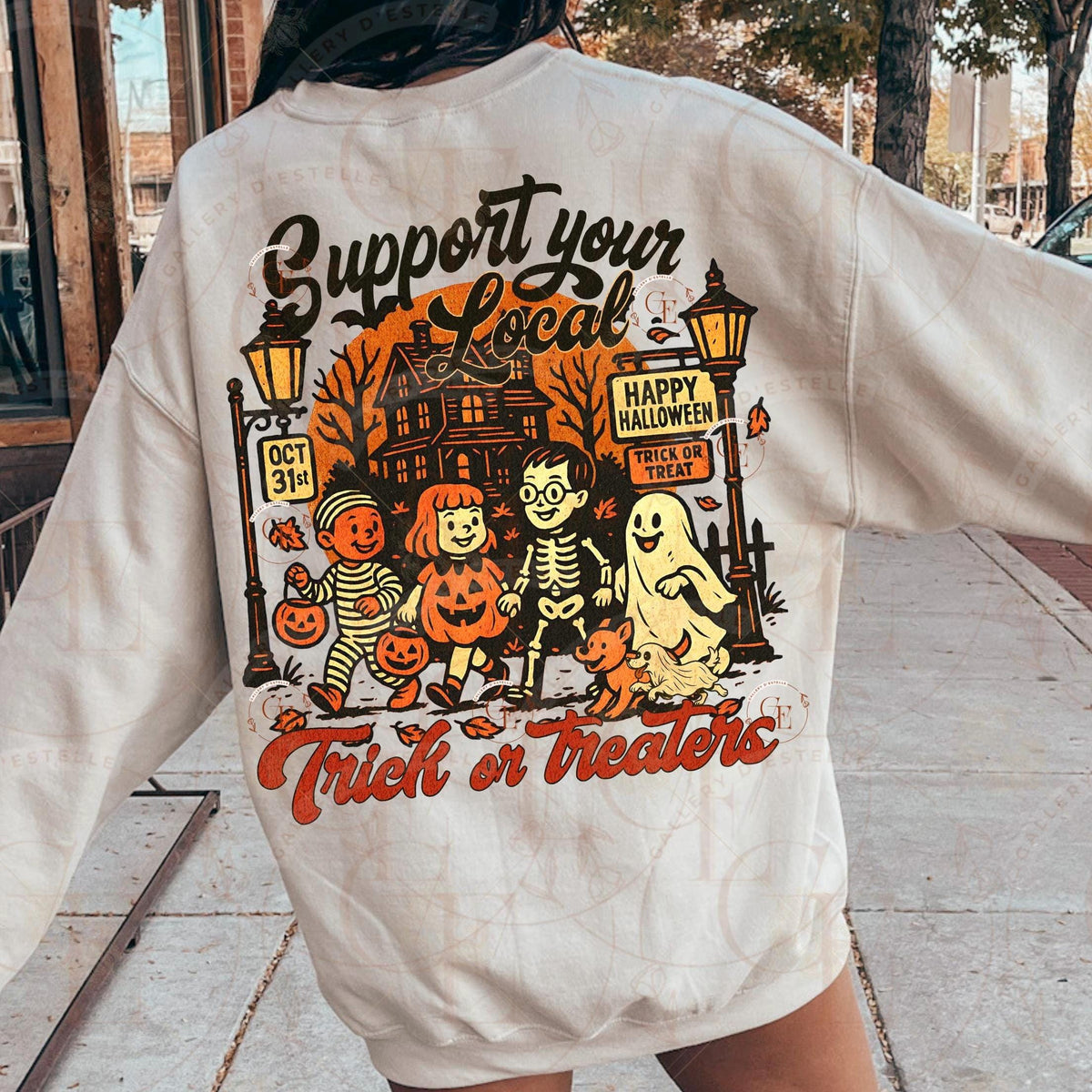 Beige sweatshirt with Halloween-themed design on the back