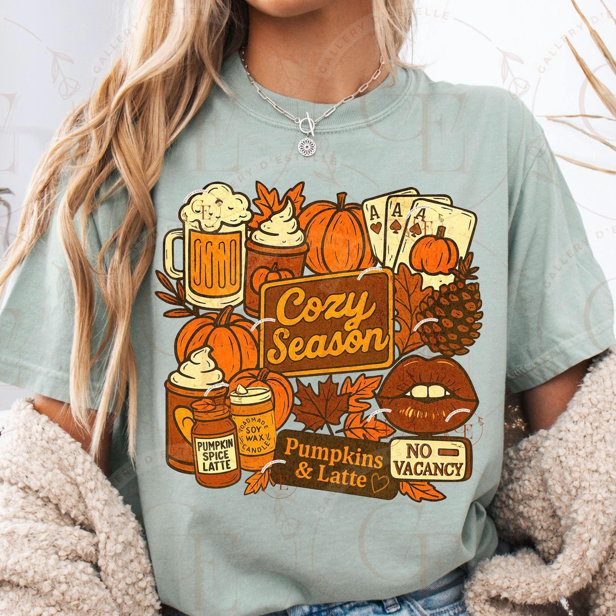 Person wearing a light green t-shirt with autumn-themed graphics and text.