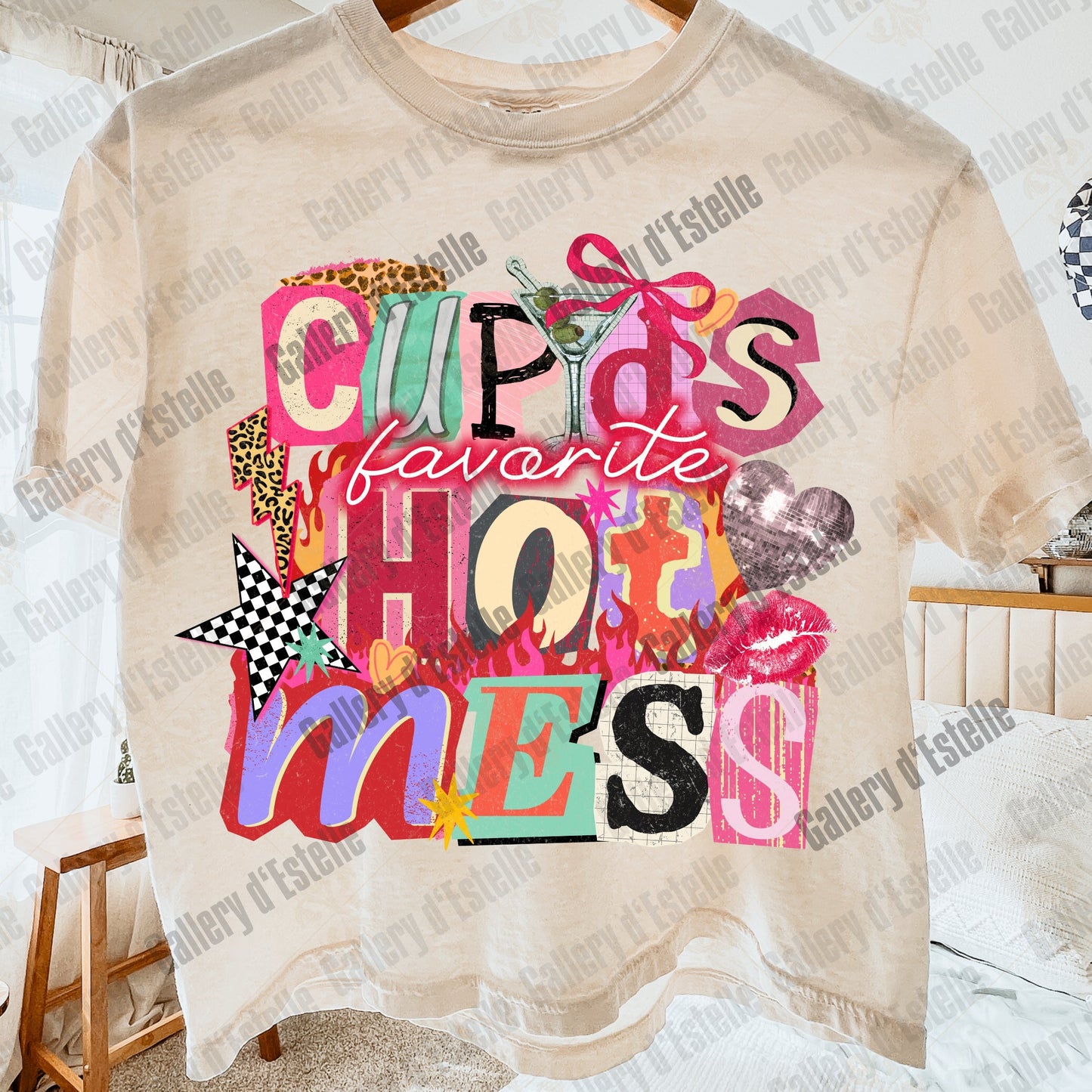 Beige t-shirt with colorful text design hanging on a hanger in a room.