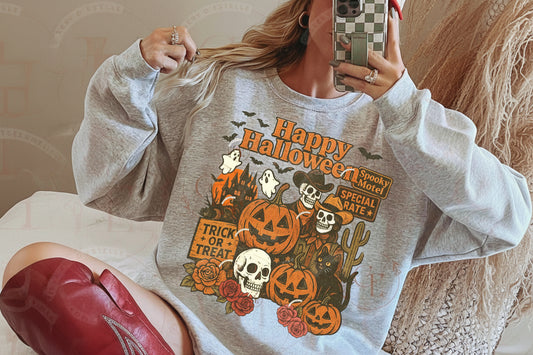 Person wearing a Halloween-themed sweatshirt with graphics and a text ' Happy Halloween'