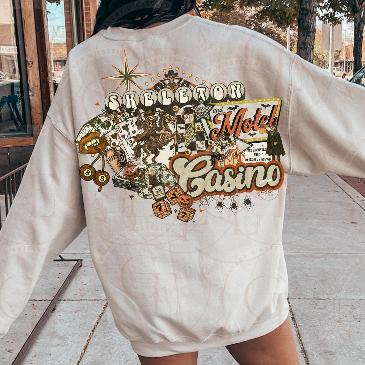 Beige sweatshirt with a colorful graphic design on the back, featuring text and images.
