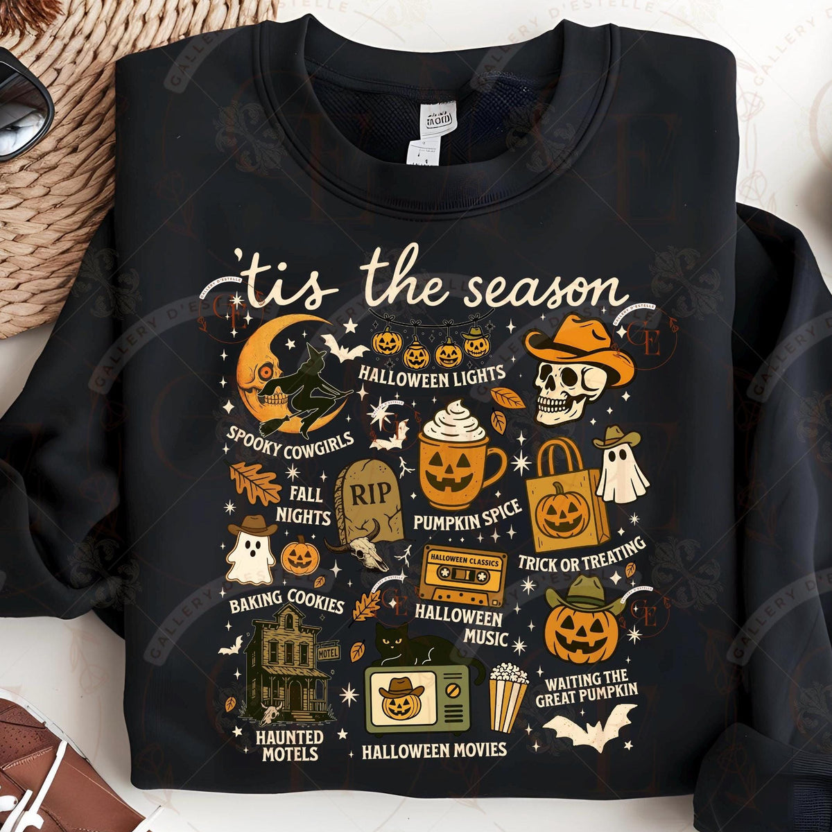 Black sweatshirt with Halloween-themed graphics and text on a light background